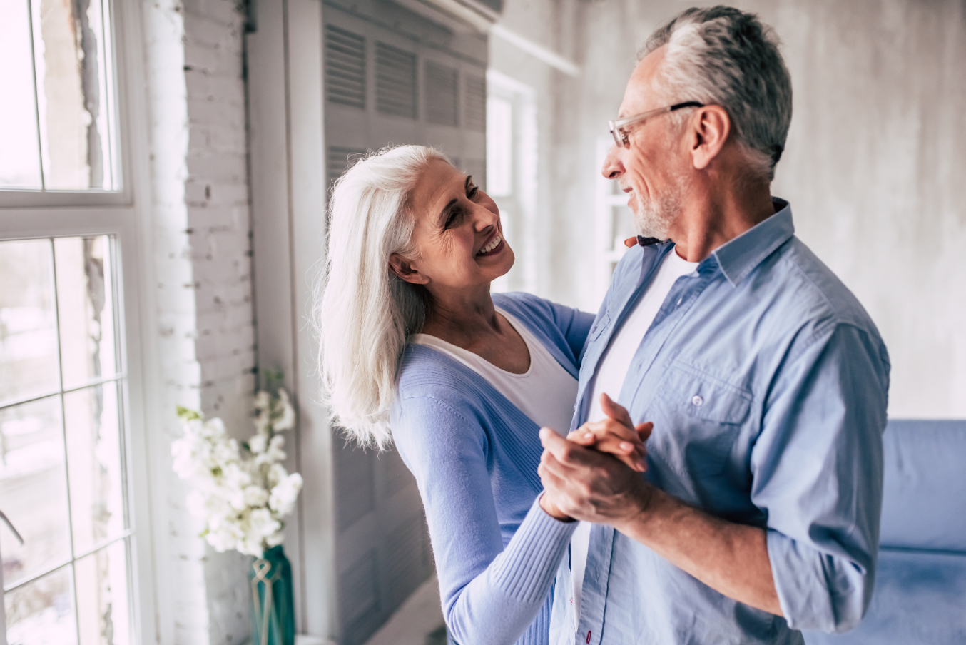 The Happy Elderly Woman And A Man Dancing